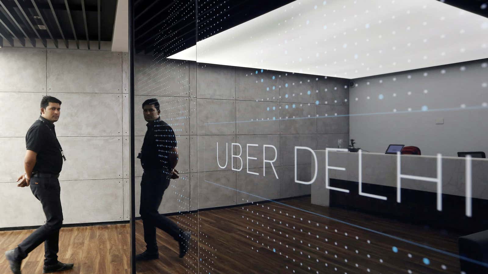 An employee walks at the office of ride-hailing service Uber in Gurugram, previously known as Gurgaon, on the outskirts of New Delhi, India, April 19,…