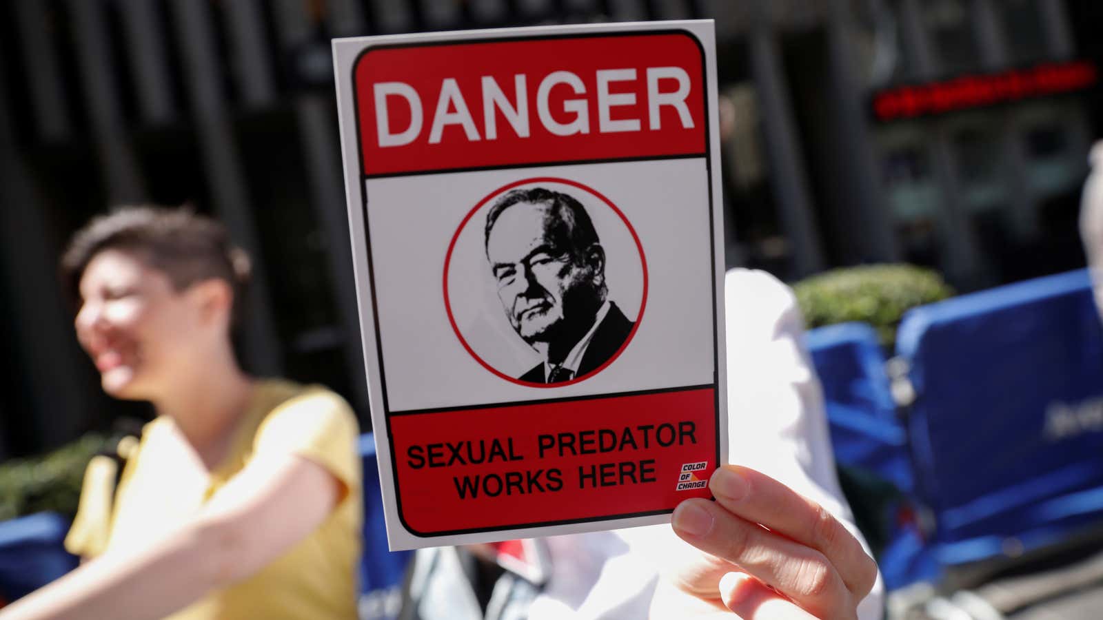 A demonstrator holds a sign at a protest calling for the firing of Fox News Channel TV anchor Bill O’Reilly outside the News Corporation headquarters…