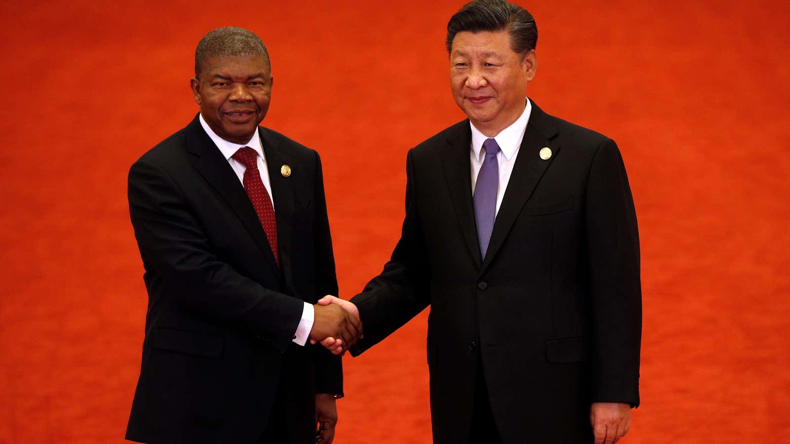Angola’s President Joao Lourenco, left, shakes hands with Chinese President Xi Jinping during the Forum on China-Africa Cooperation in Beijing September 3, 2018.