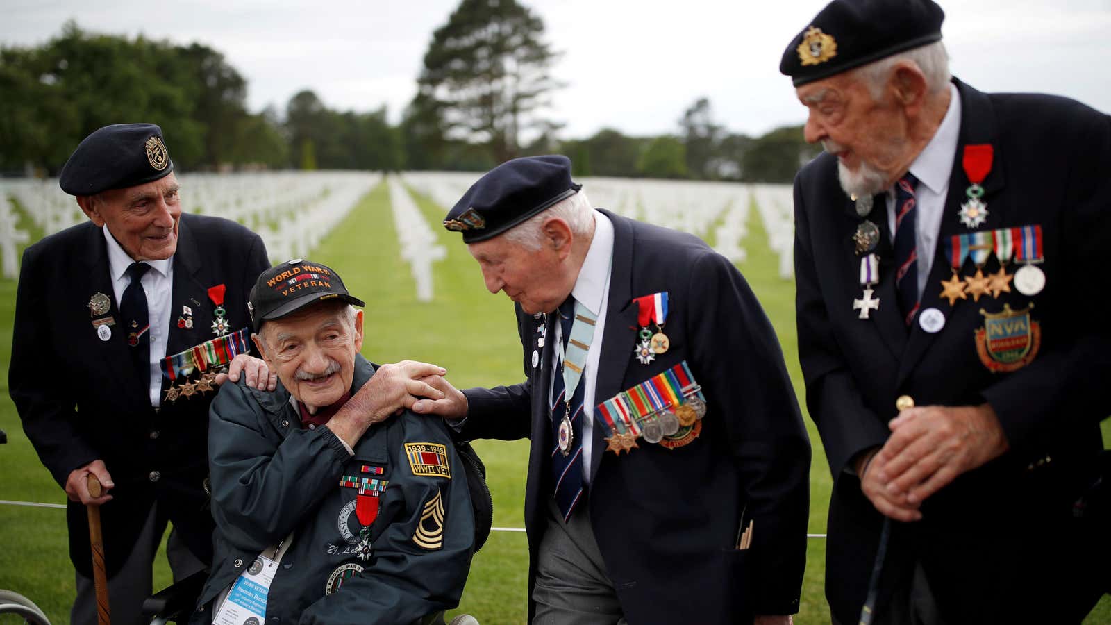 D-Day veterans, including Richard Llewellyn and Mervyn Kersh from Britain and Norman Duncan from the US, attend a ceremony near Omaha Beach on June 4.