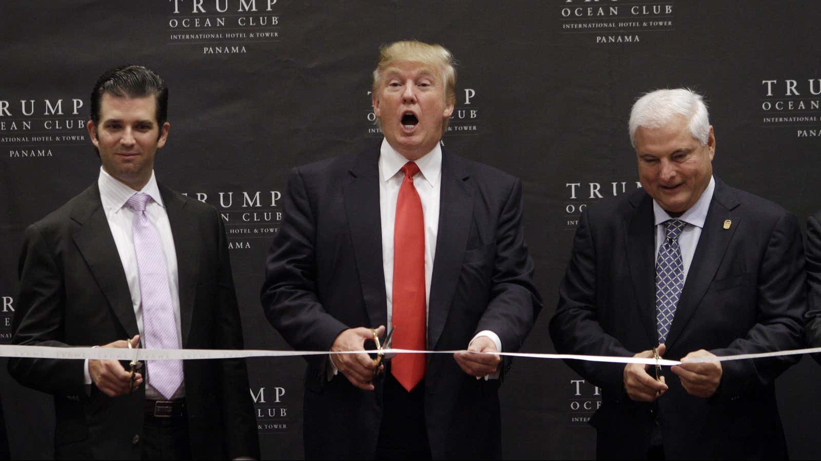 Trump and his son Donald Jr. open the hotel alongside Panama’s president in 2011.