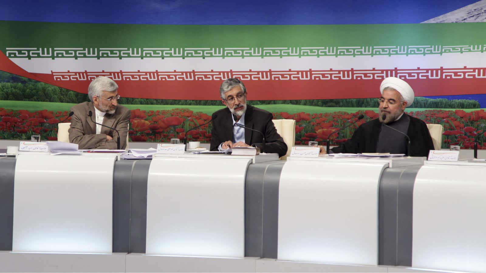 Hard-line favorite Jalili, left, and reformist-backed Rohani, right.