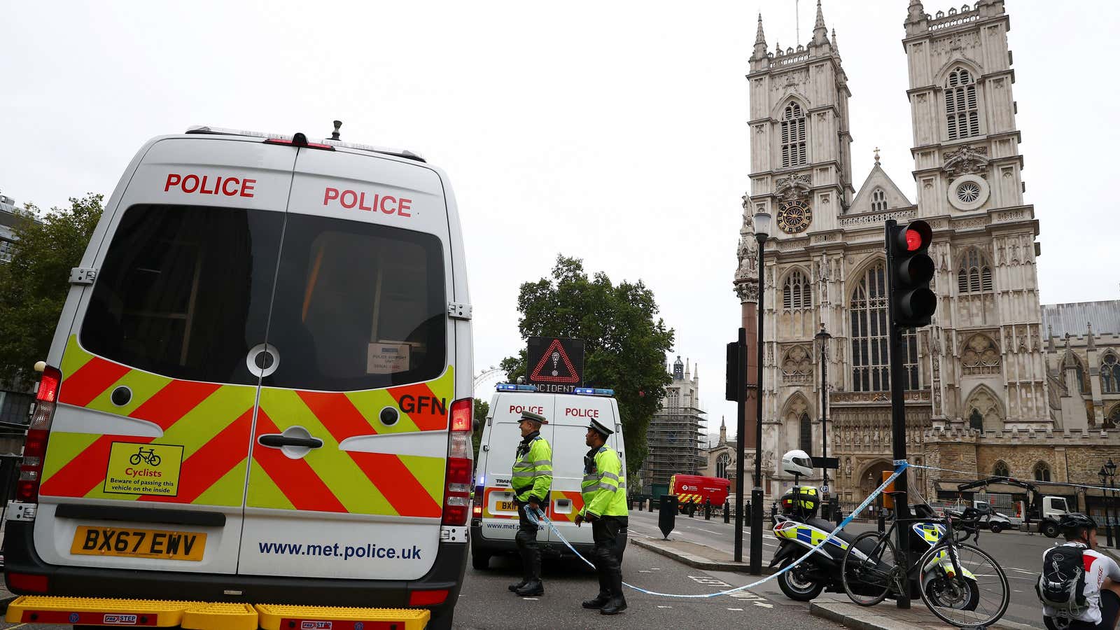 Police stand at a cordon outside the Houses of Parliament in Westminster, London.