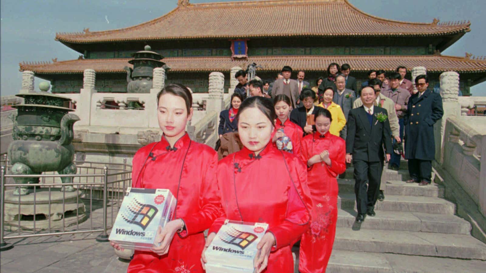 Two women carry boxes of Microsoft Windows 95 through Beijing’s Forbidden City in 1996. The Chinese version of the operating system was officially launched in China in a ceremony in the Forbidden City, the former palace of China’s emperors.