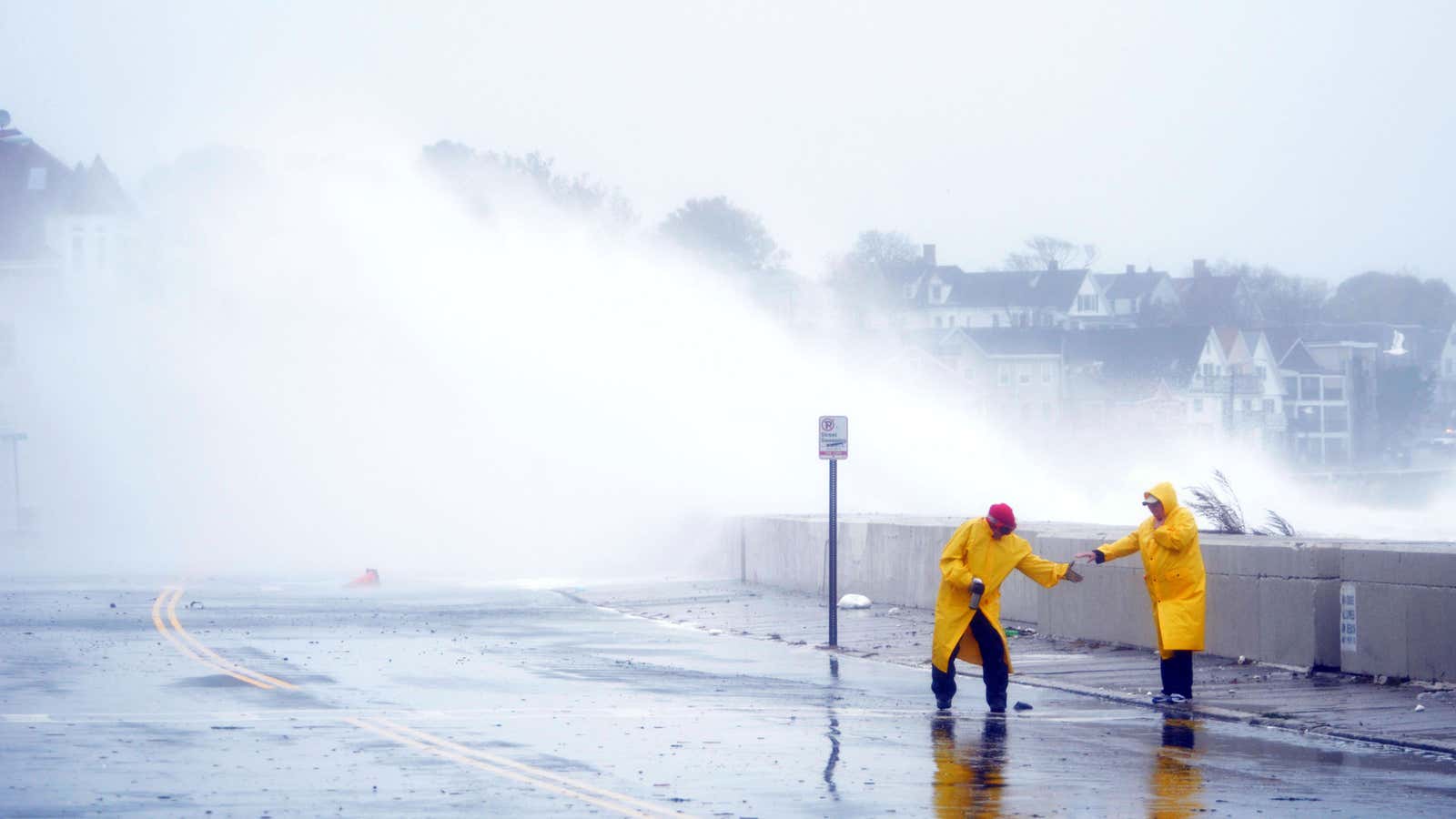 Waves crash over Winthrop Shore Drive in Winthrop, Mass., as Hurricane Sandy comes up the coast of the US