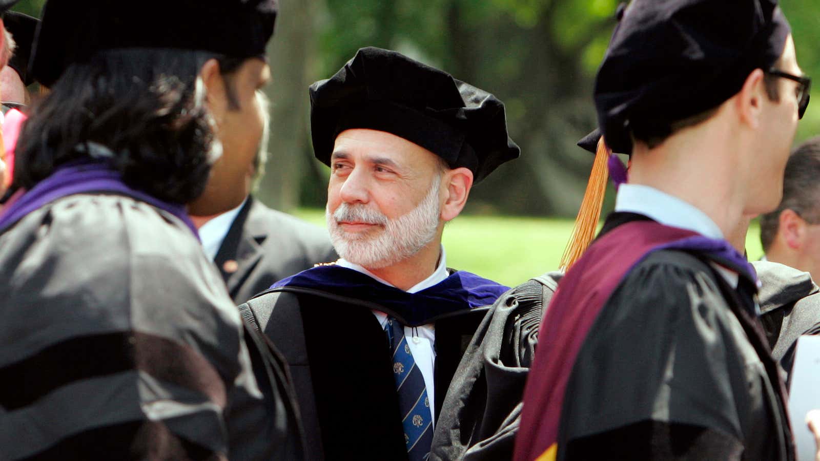 Former Fed Reserve chairman Ben Bernanke watches law students graduate.