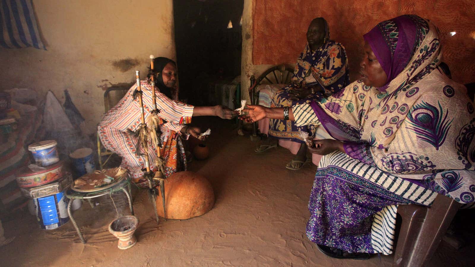 A patient receives medicine during her treatment with a spiritual and traditional healer in Sudan