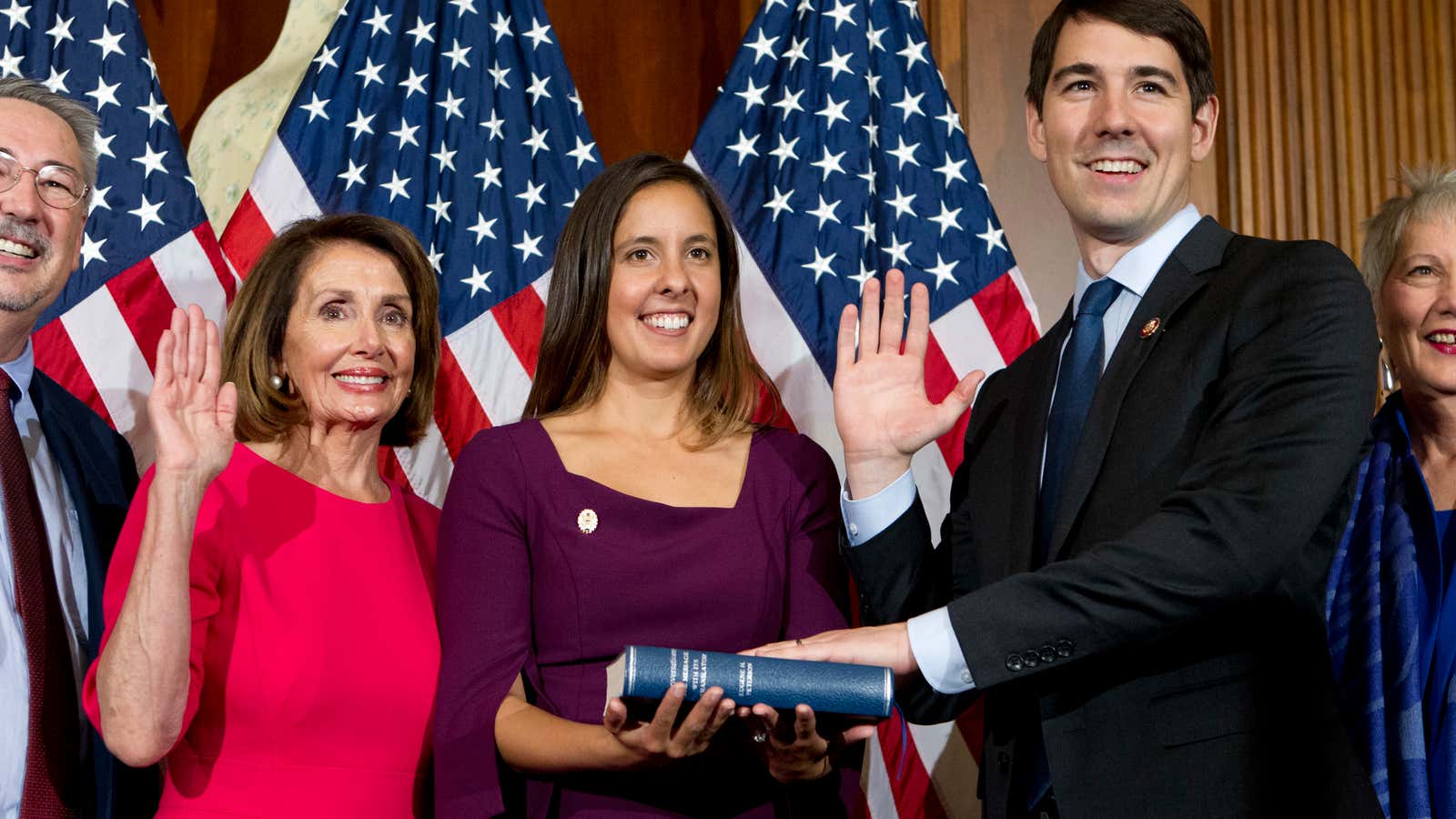 House Speaker Nancy Pelosi of Calif., administers the House oath of office to Rep. Josh Harder, D-Calif., during ceremonial swearing-in on Capitol Hill in Washington, Thursday, Jan. 3, 2019, during the opening session of the 116th Congress. (AP Photo/Jose Luis Magana)