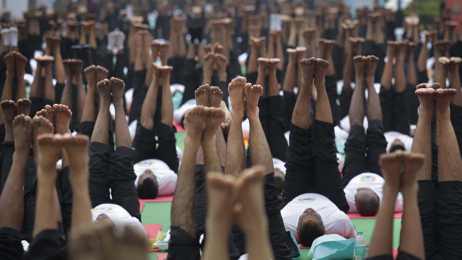 In this Wednesday, June 21, 2017, file photo, participants perform yoga to mark International Yoga Day in New Delhi, India. Millions of yoga enthusiasts across…