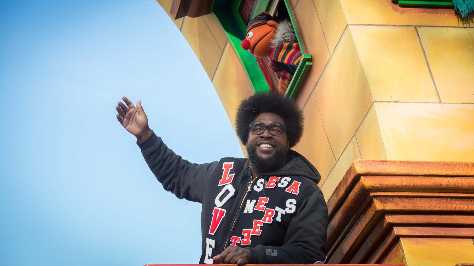 Questlove waves from a float during the Macy’s Thanksgiving Day Parade, Thursday, Nov. 26, 2015, in New York. (AP Photo/Bryan R. Smith)