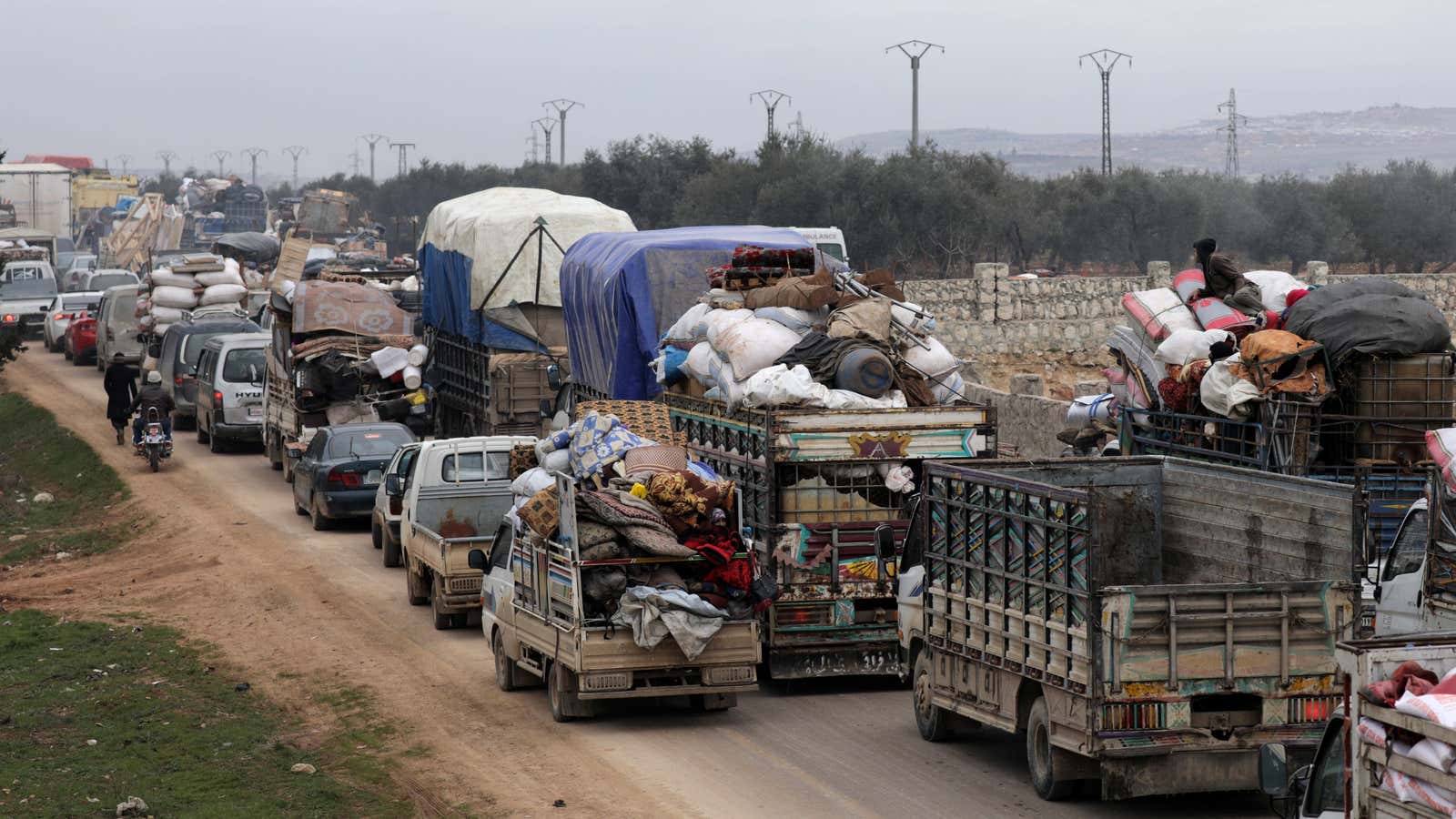 Vehicles carrying the belongings of displaced persons.