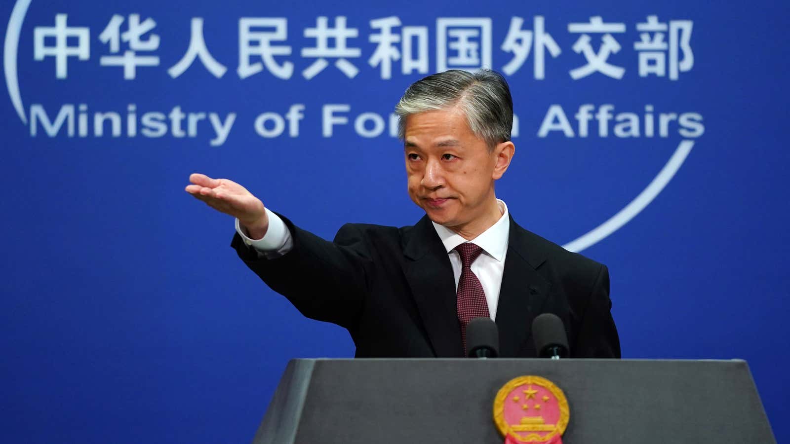 Chinese foreign ministry spokesman Wang Wenbin gestures during a news conference in Beijing