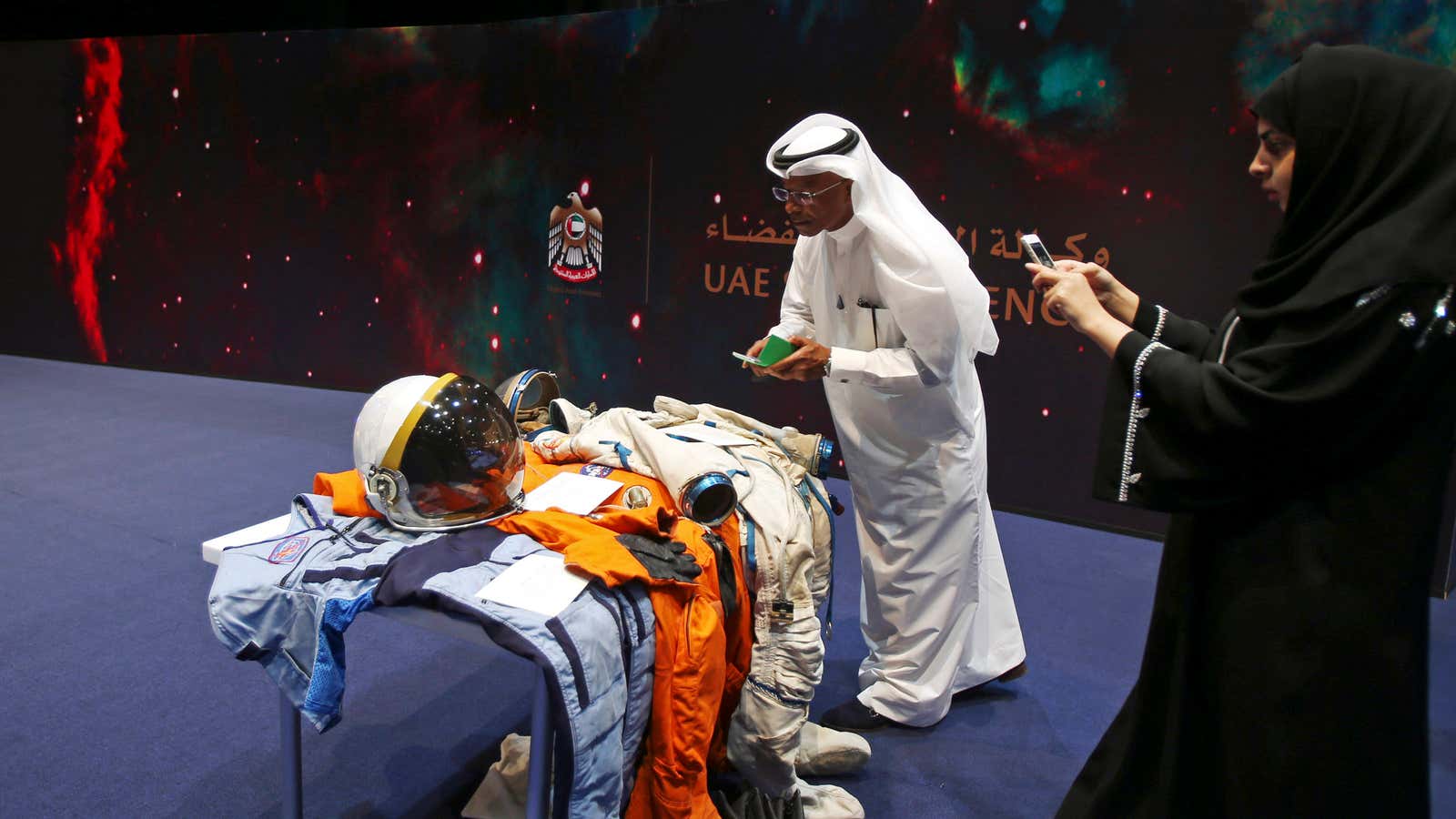 Emiratis check out space suits during the launch of the UAE space agency in 2015.