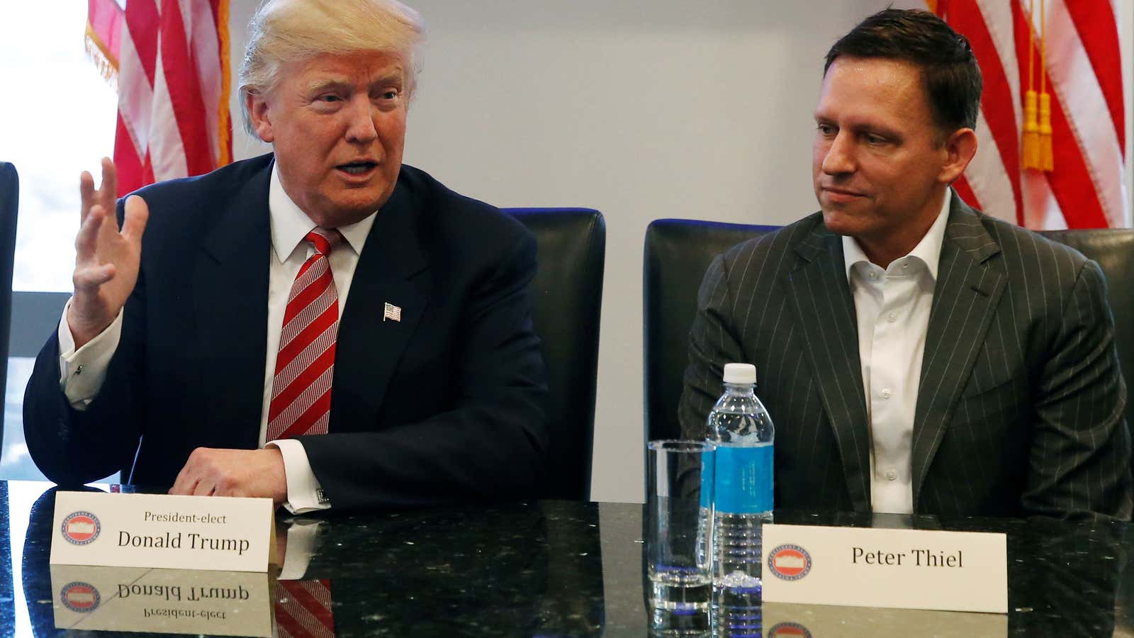 U.S. President-elect Donald Trump sits with PayPal co-founder and Facebook board member Peter Thiel, during a meeting with technology leaders at Trump Tower in New…
