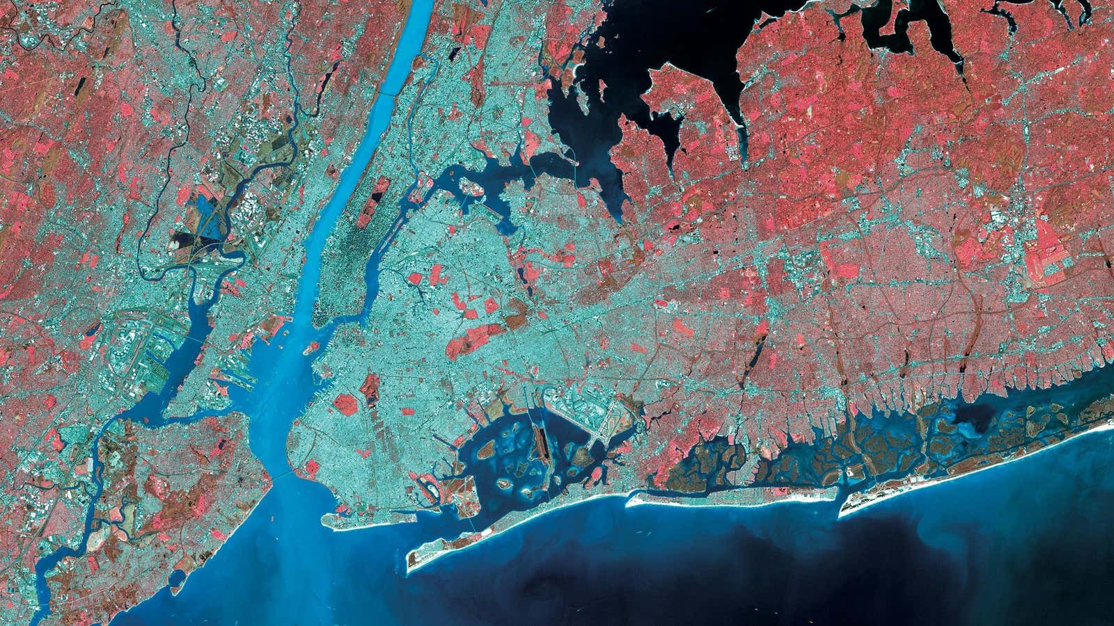 Manhattan’s dense grid is highlighted amid the wider city. The central island is fringed with piers down its west side, once serving as an entry point for the city’s many immigrants and industry hubs for the waterfront. Now, many of these piers are in disrepair or have been reclaimed as public spaces.