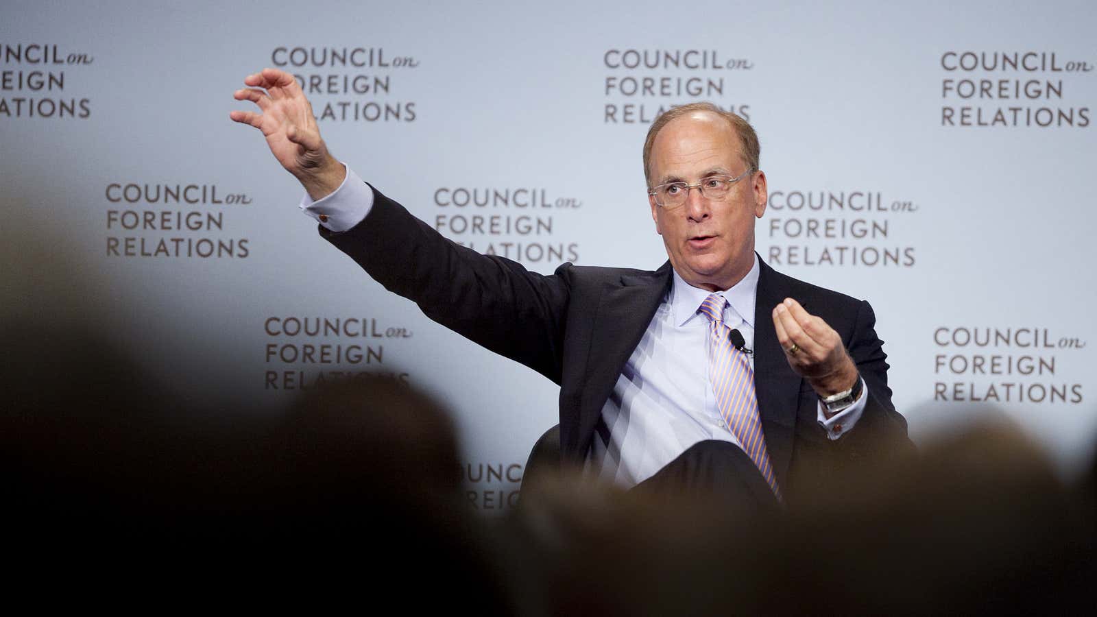 BlackRock’s Larry Fink, utilizing the rare Sicilian hand gesture which translates, loosely, as “I am far too rich to be worried about anything.”