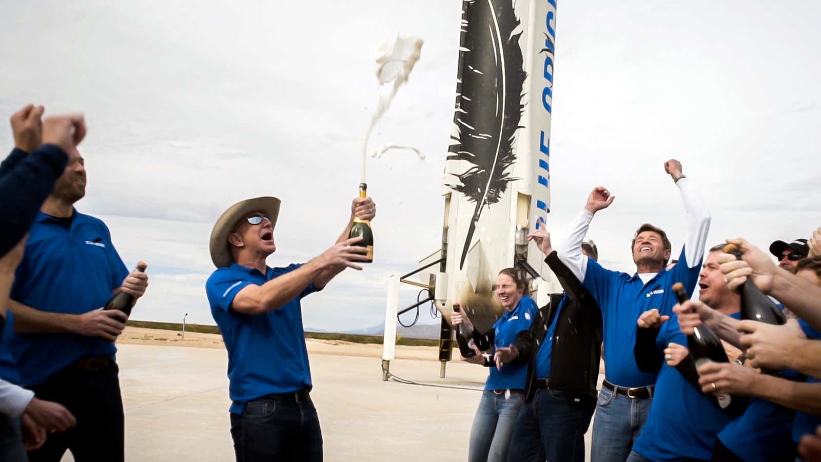Bezos and his team celebrate the first successful landing of the New Shepard rocket booster.