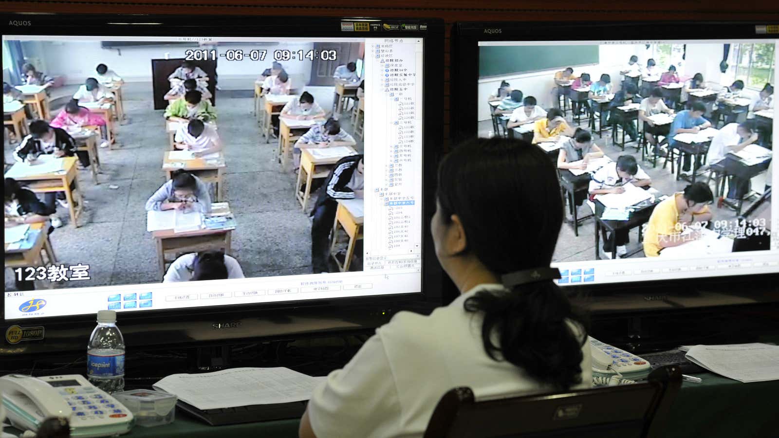 An exam monitor watches students taking the gaokao in Chongqing.