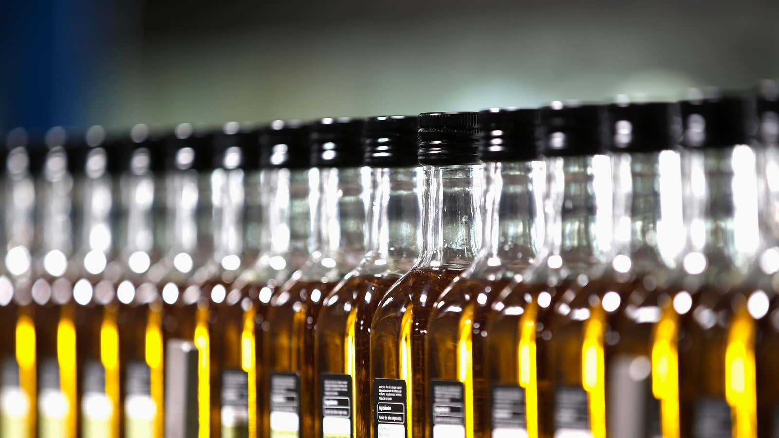 Bottles of olive oil are lined in a factory in Dos Hermanas, near the Andalusian capital of Seville.