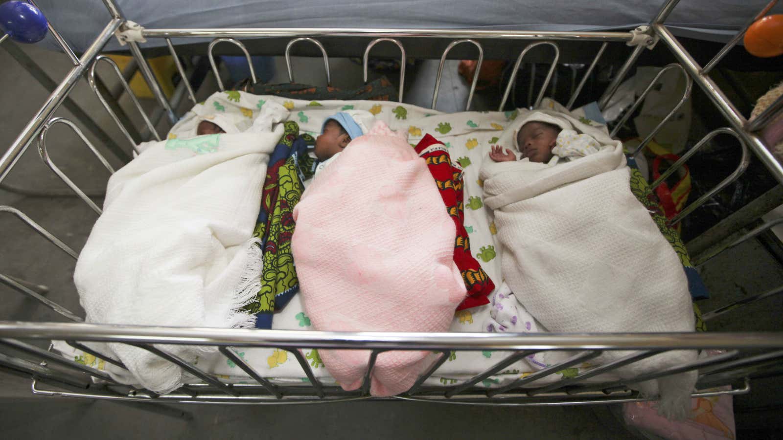 Newborn triplets Isaac, Treasure and Samuel sleep in a ward of the Lagos Island Maternity Hospital in Lagos, Nigeria, Monday, Oct. 31, 2011. Amid the…