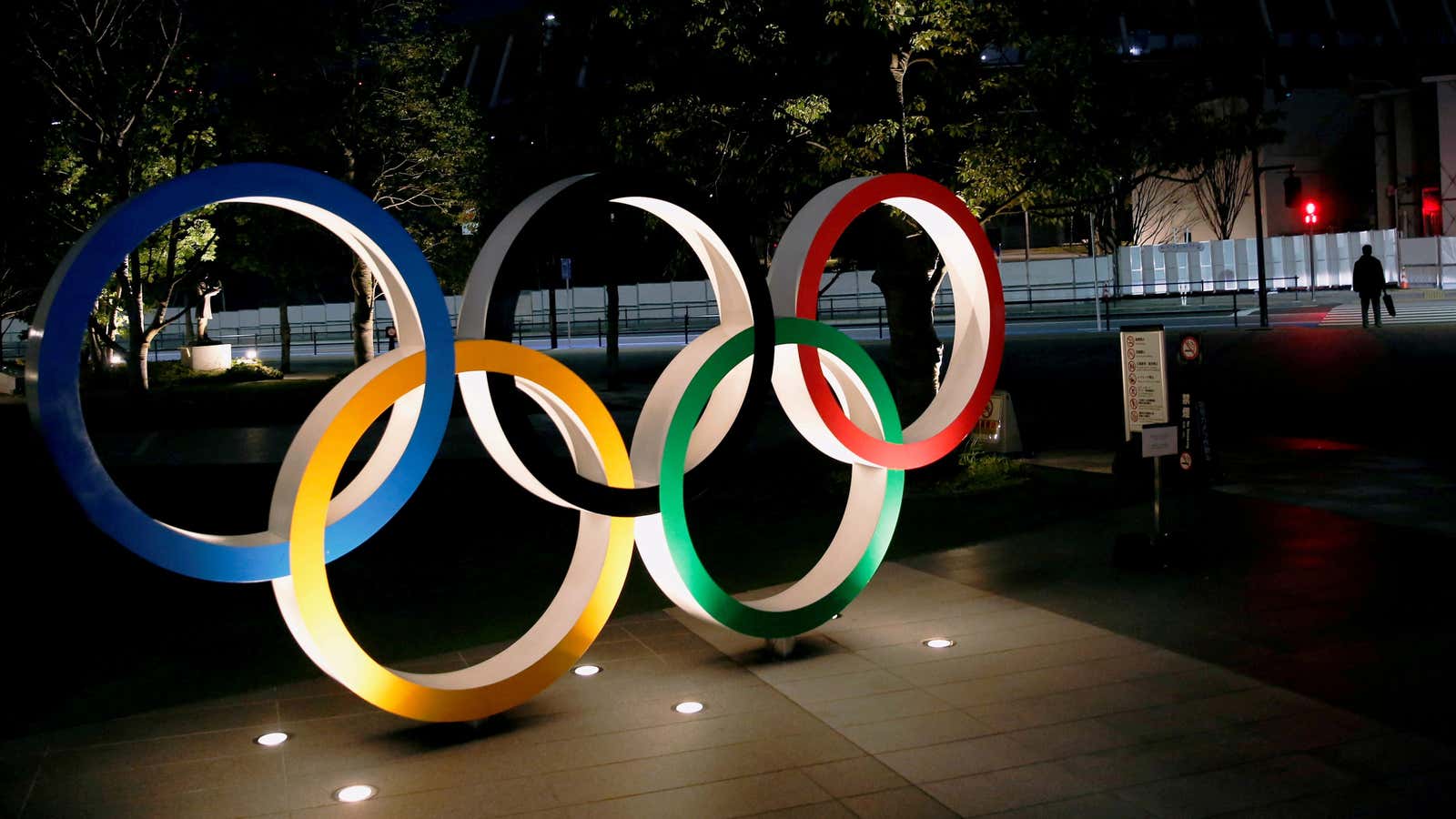 The Olympic rings are illuminated in front of the National Stadium in Tokyo, Japan January 22, 2021.