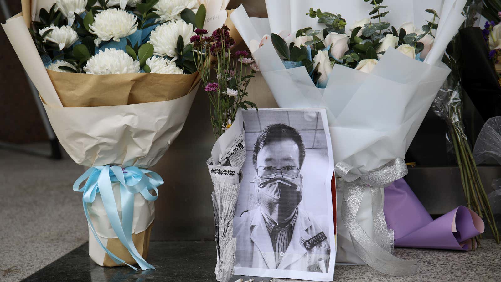 A makeshift memorial for Li Wenliang, a doctor who issued an early warning about the coronavirus outbreak before it was officially recognized, is seen after…