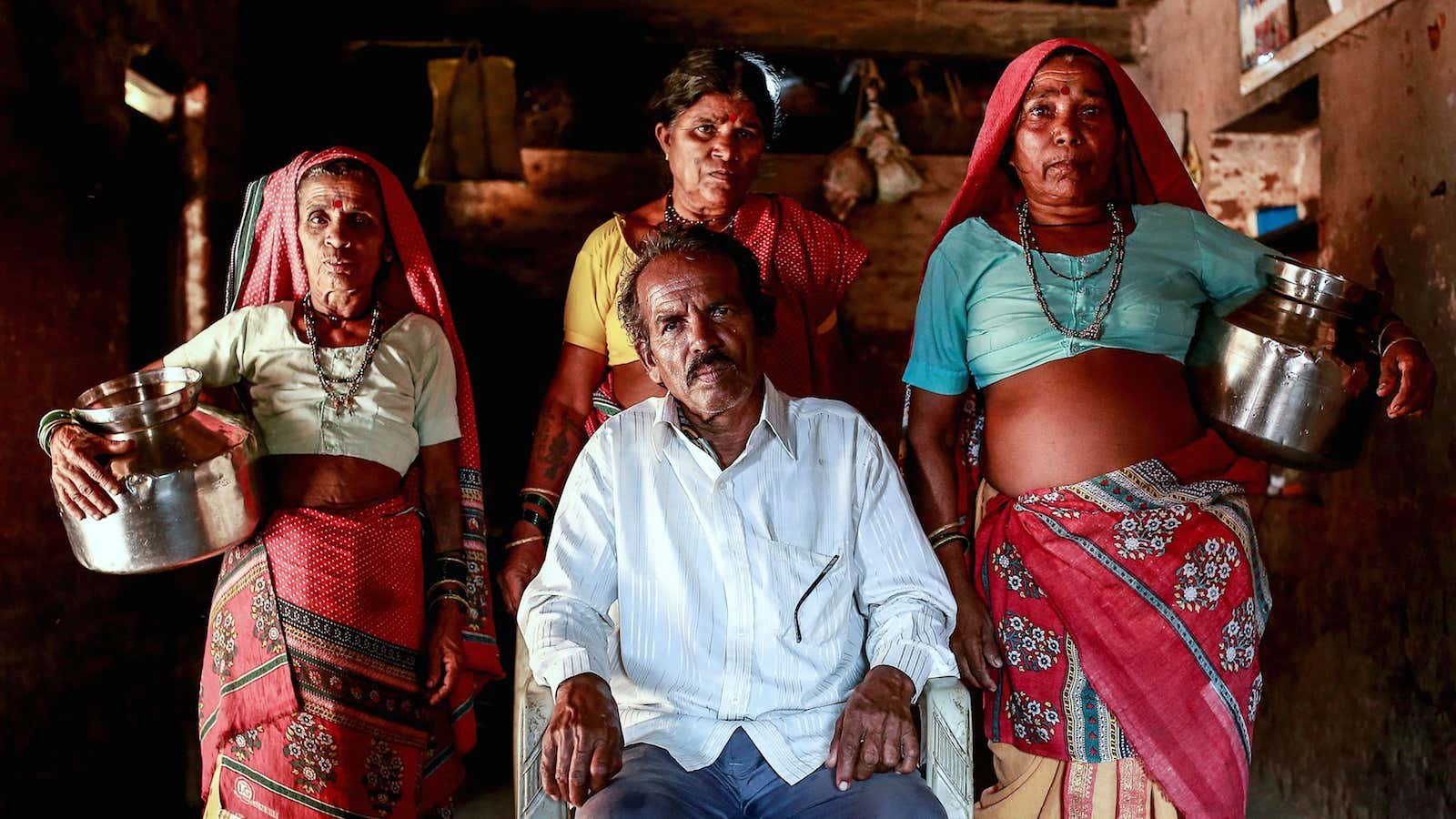 Sakharam Bhagat, 66, poses with his wives.