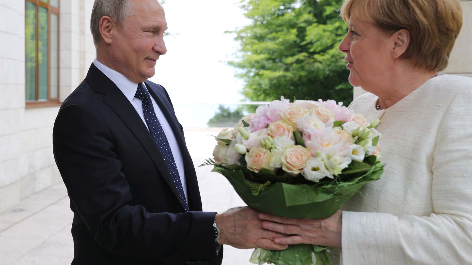Putin says it with roses.