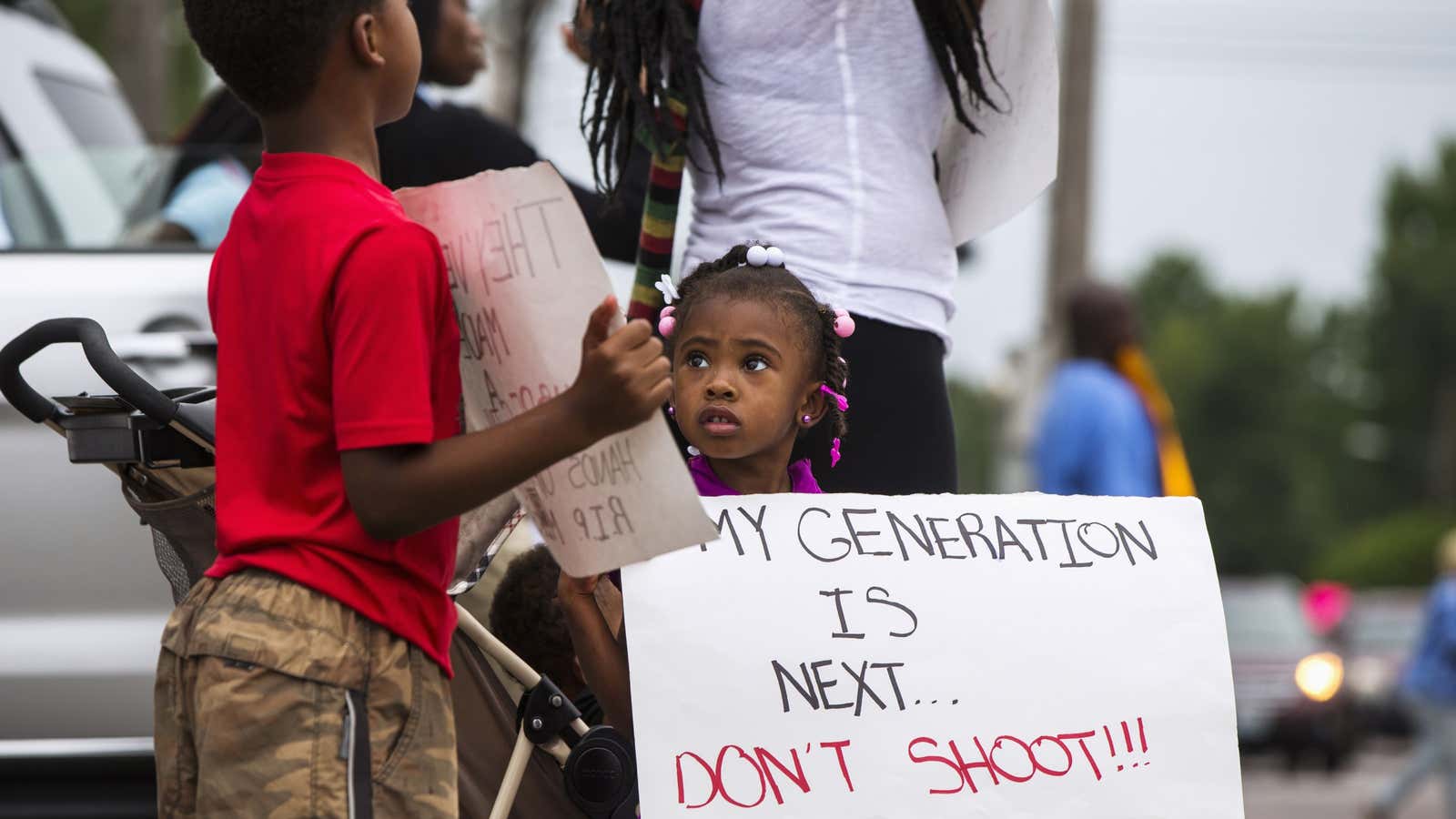 A child attends a rally in Ferguson.