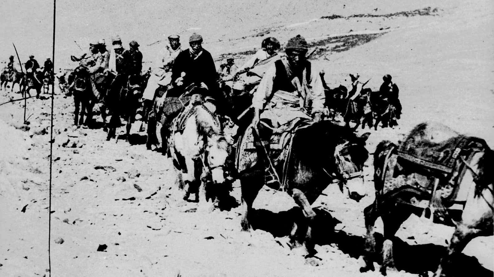 The 23-year-old Dalai Lama and his escape party is shown on the fourth day of their flight to freedom as they cross the Zsagola pass, in Southern Tibet, while being pursued by Chinese military forces, on March 21, 1959, after fleeing Lhasa.