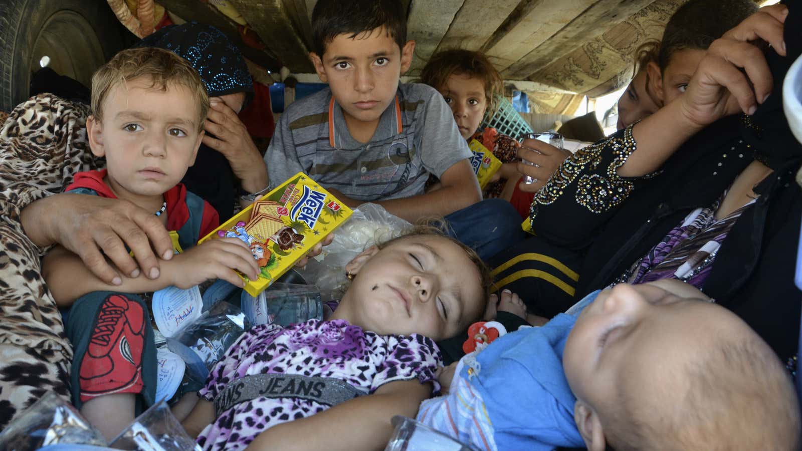 Refugees flee Islamic militants in Iraq in 2014.