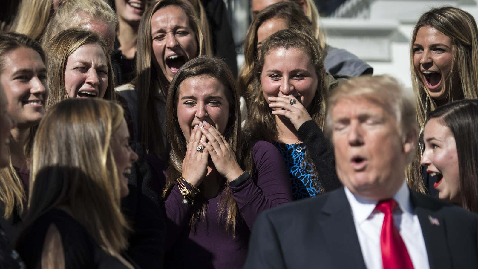 Members of the University of Maryland women’s lacrosse team react to something President Donald Trump said after posing for photographs at the White House on Nov. 17, 2017.
