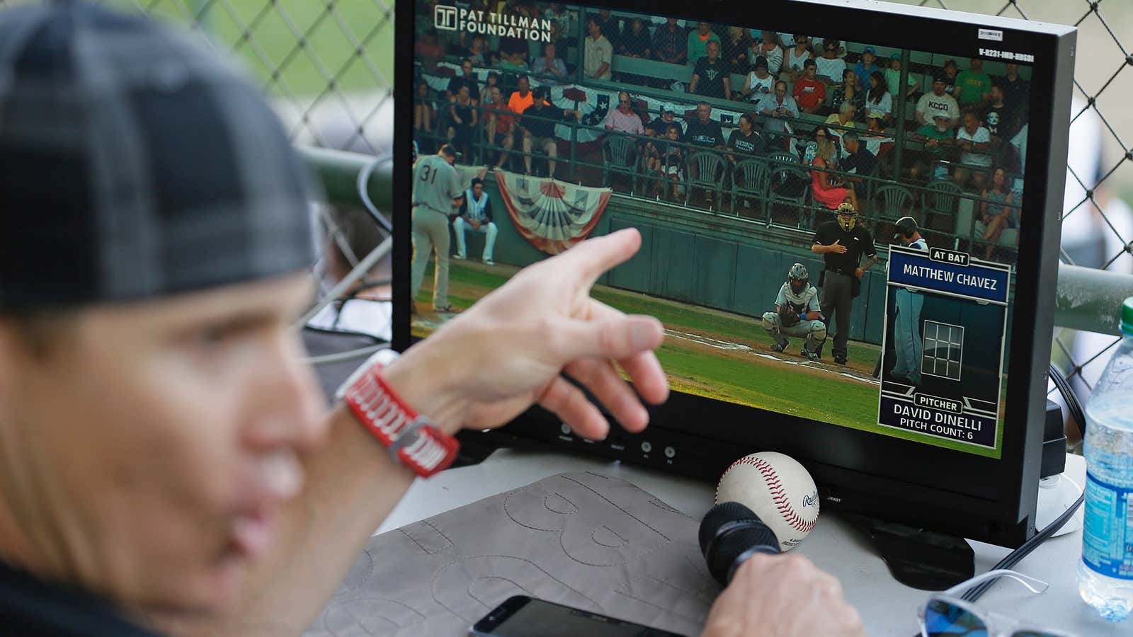 Eric Byrnes gestures while using a computerized video system to call balls and strikes at a game between the San Rafael Pacifics and Vallejo Admirals.