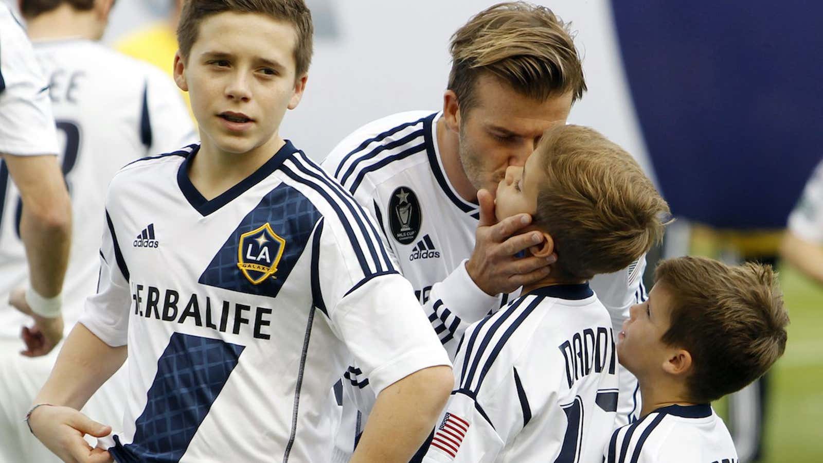 Beckham with his three sons in 2012.