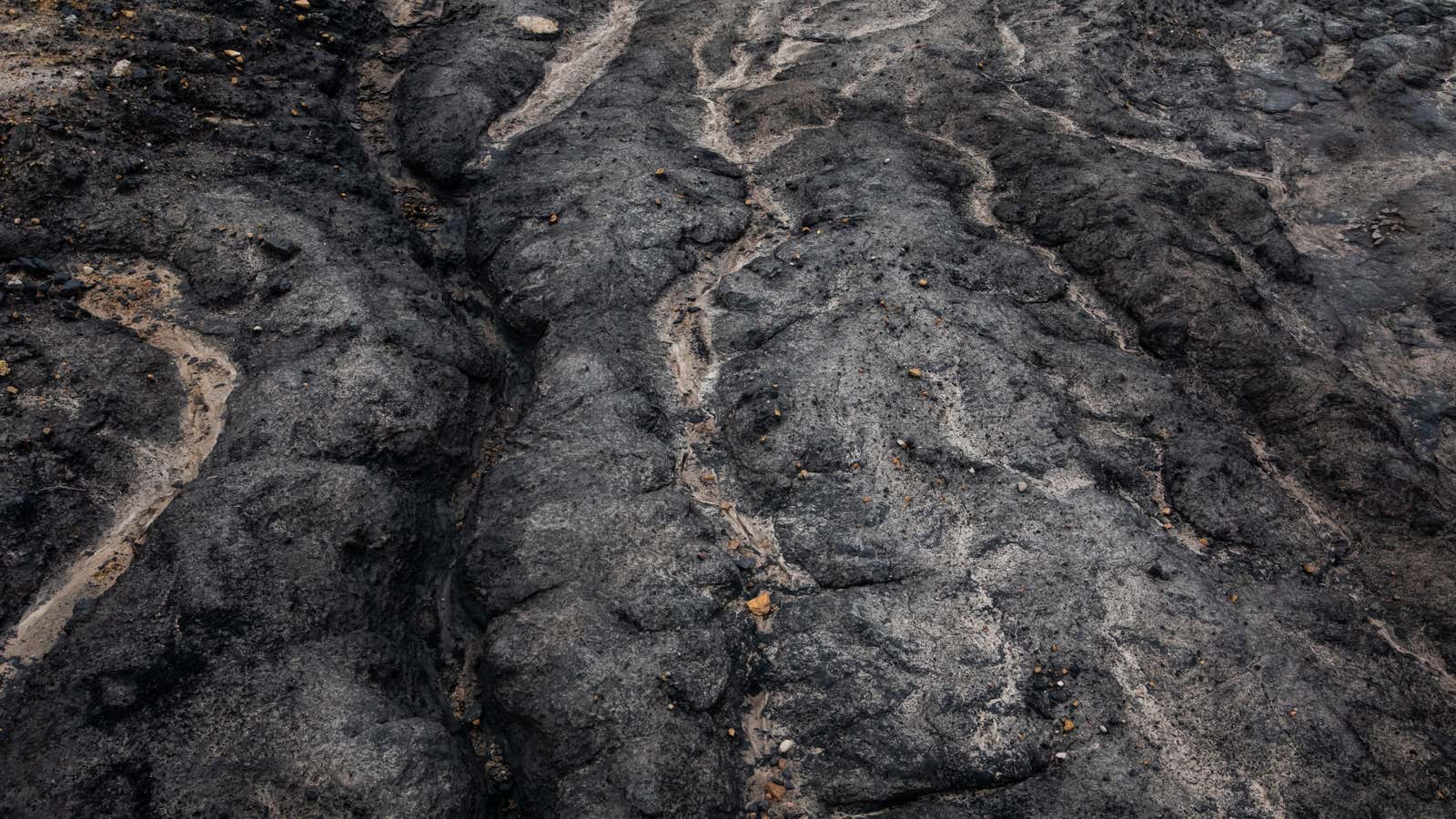 Paths traced by water on the surface of a coal mine.