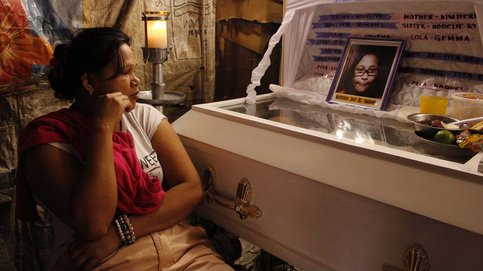 A mother buries her child in Duterte’s Philippines.