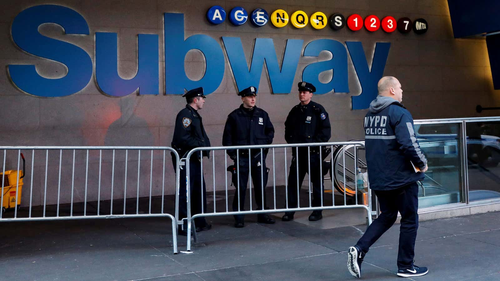 The Port Authority subway station entrance is guarded by police on Dec. 11.