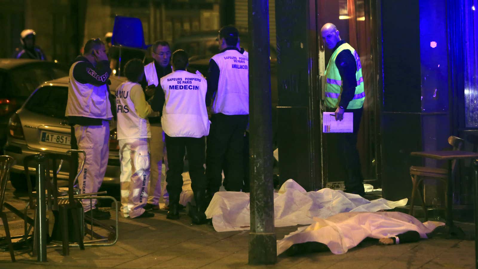 Medical staff stand by victims in a Paris restaurant, Friday, Nov. 13.