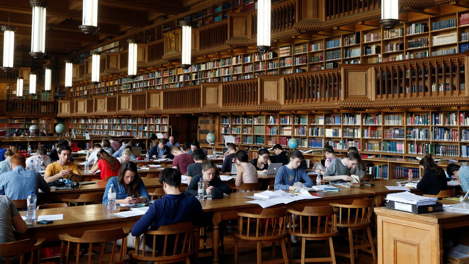 tudents sit in the library of the university KU Leuven in Leuven