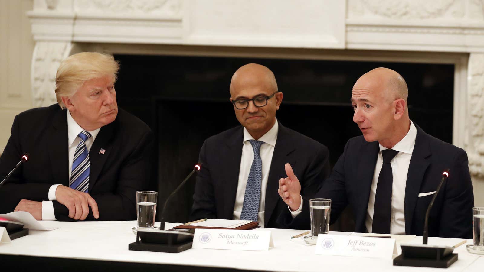 Donald Trump, left, is sparring with Jeff Bezos, right, yet again.