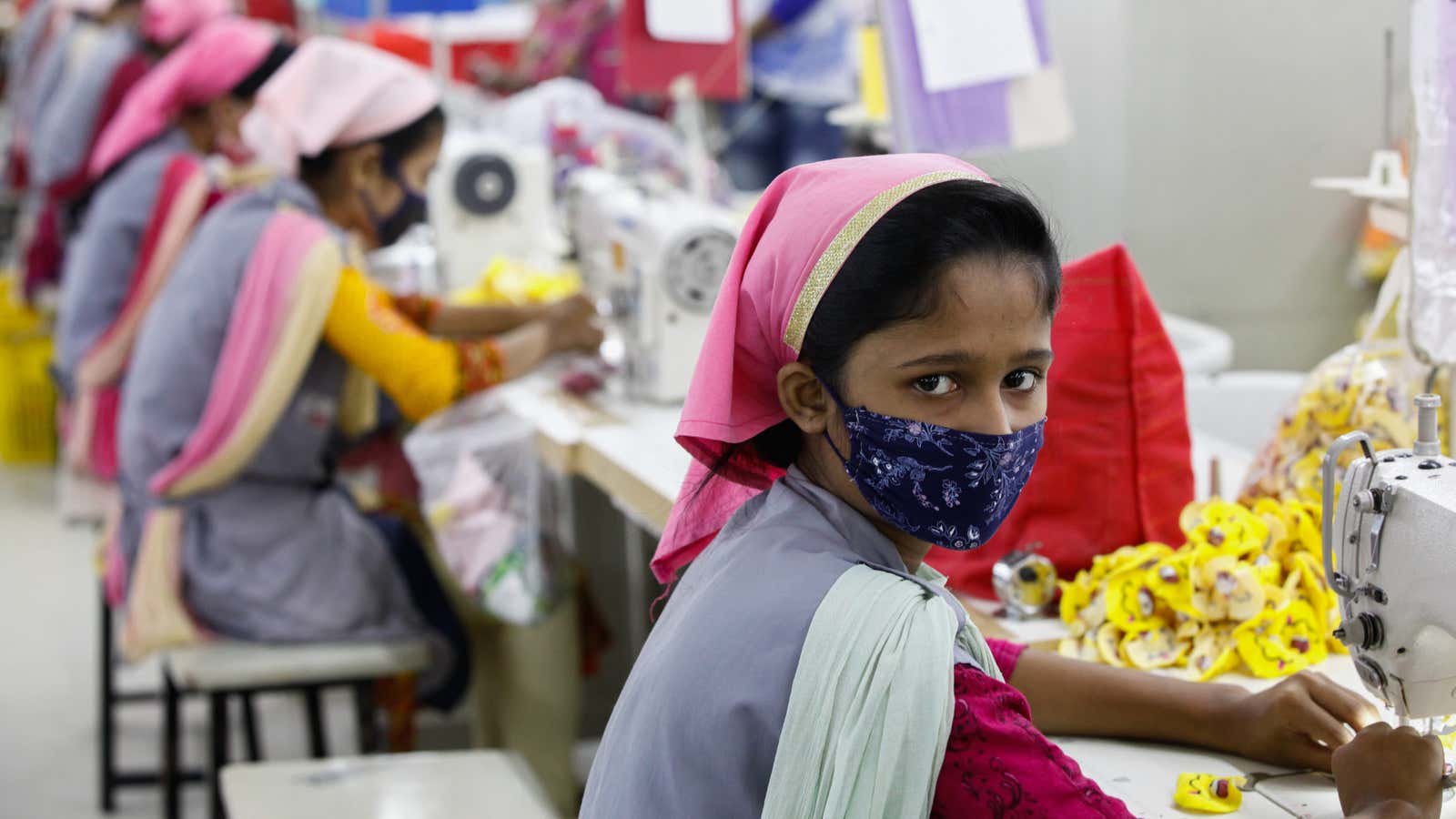 A girl working at a garment factory in Bangladesh.