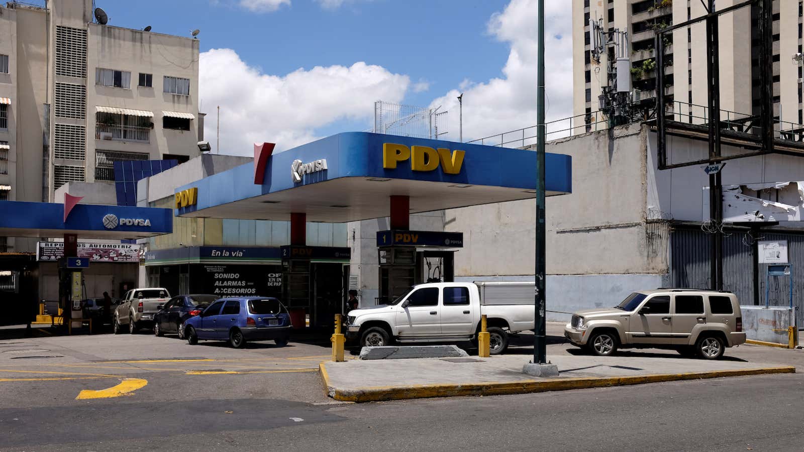 Venezuelans line up for gas in Caracas. But bondholders don’t have to line up for payments.