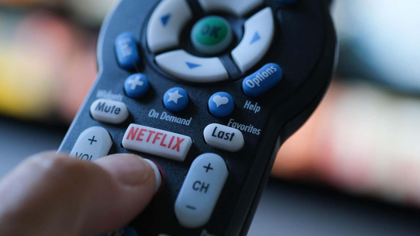 A television remote control featuring a dedicated Netflix button. 
