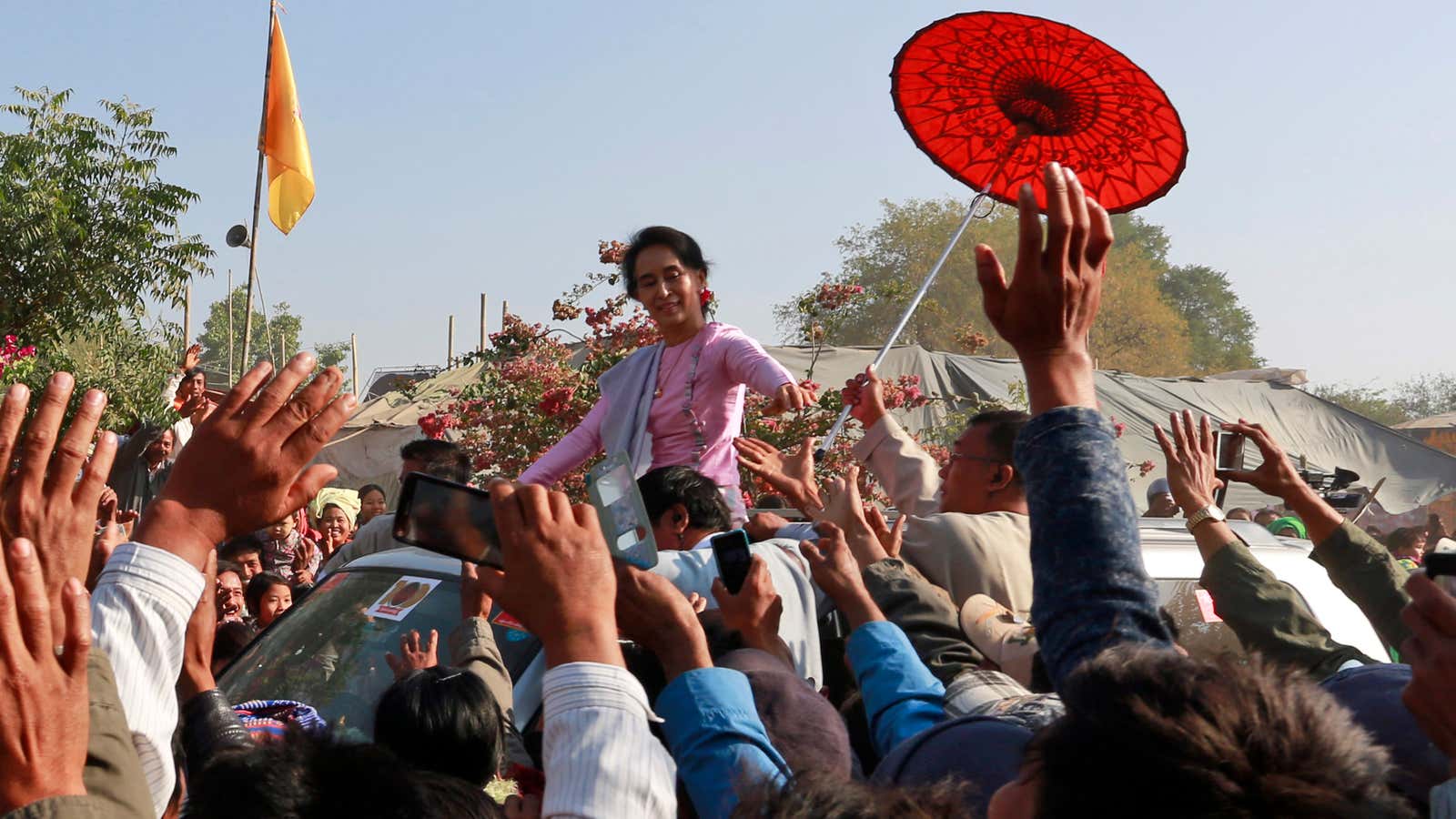 Aung San Suu Kyi greets supporters here, but is silent on issues that greatly demand her attention.