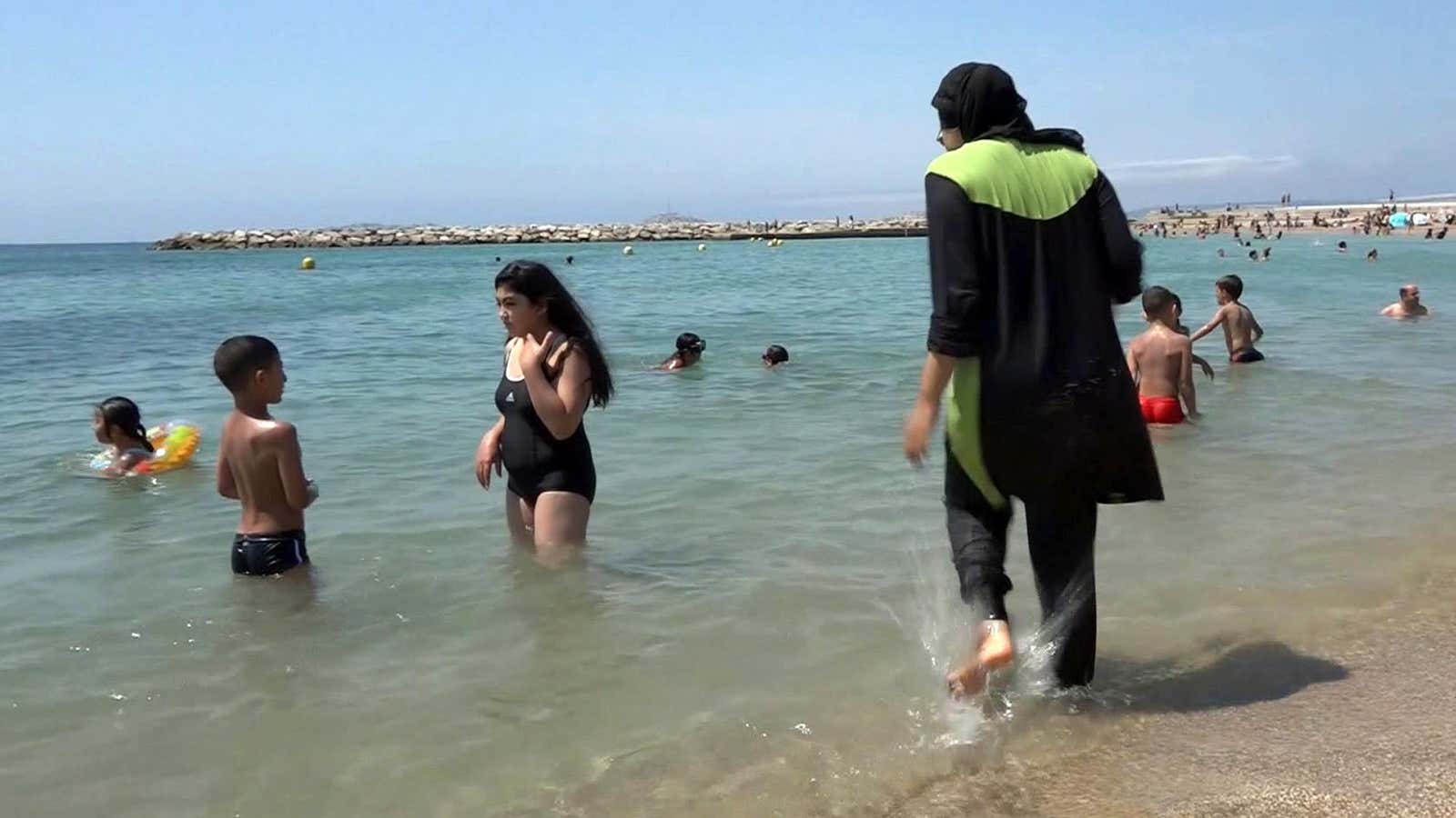 The sun is back—and so is the burkini debate.
