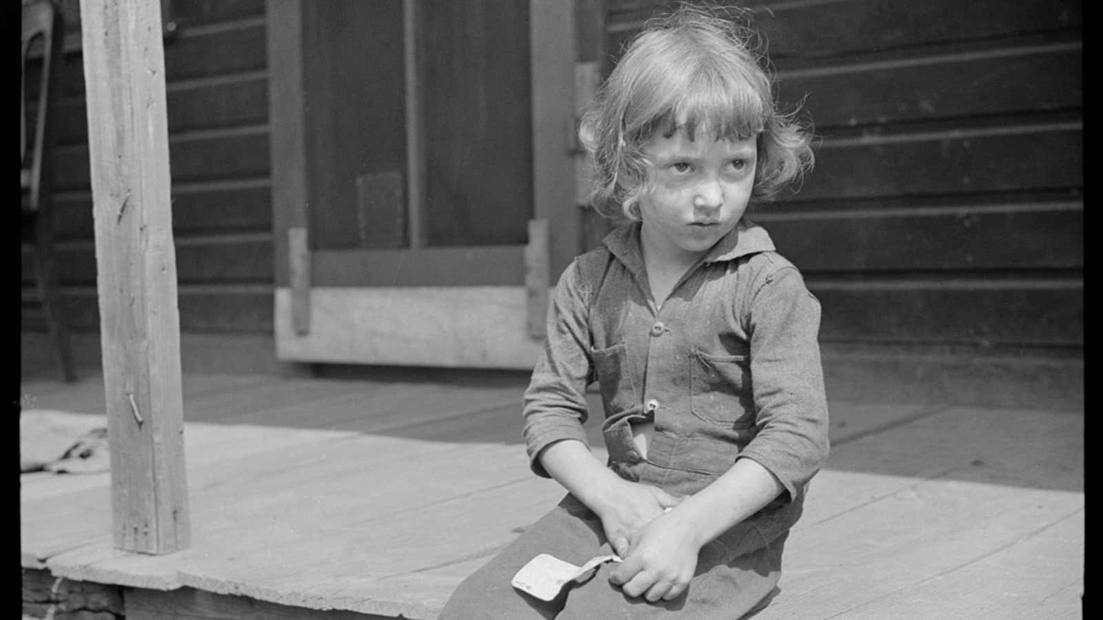 Child of a coal miner in Scotts Run, West Virginia, 1938. Part of a project to document American poverty for the Farm Security Administration.