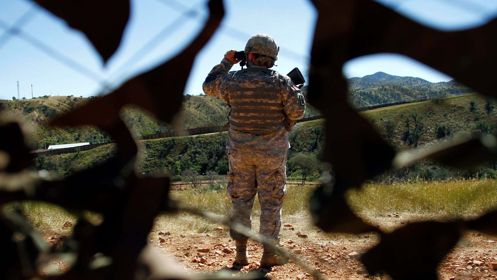A member of the United States National Guard patrols along the U.S. and Mexico border in Nogales, Arizona in 2010.