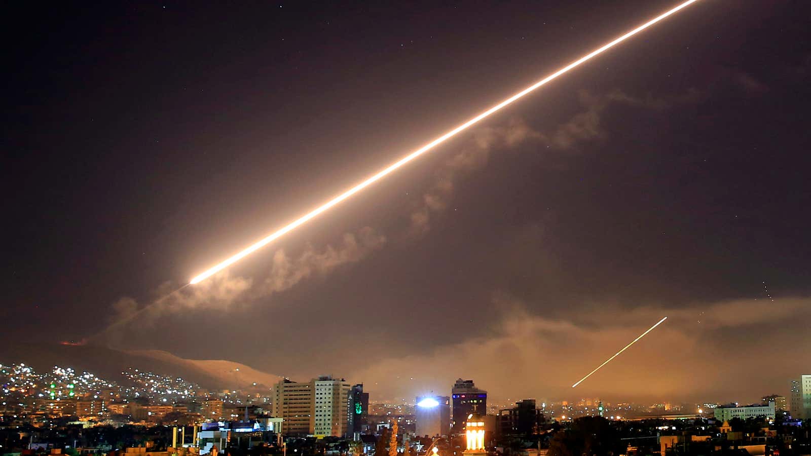 Damascus skies erupt with surface to air missile fire as the U.S. launches an attack on Syria targeting different parts of the Syrian capital Damascus,…
