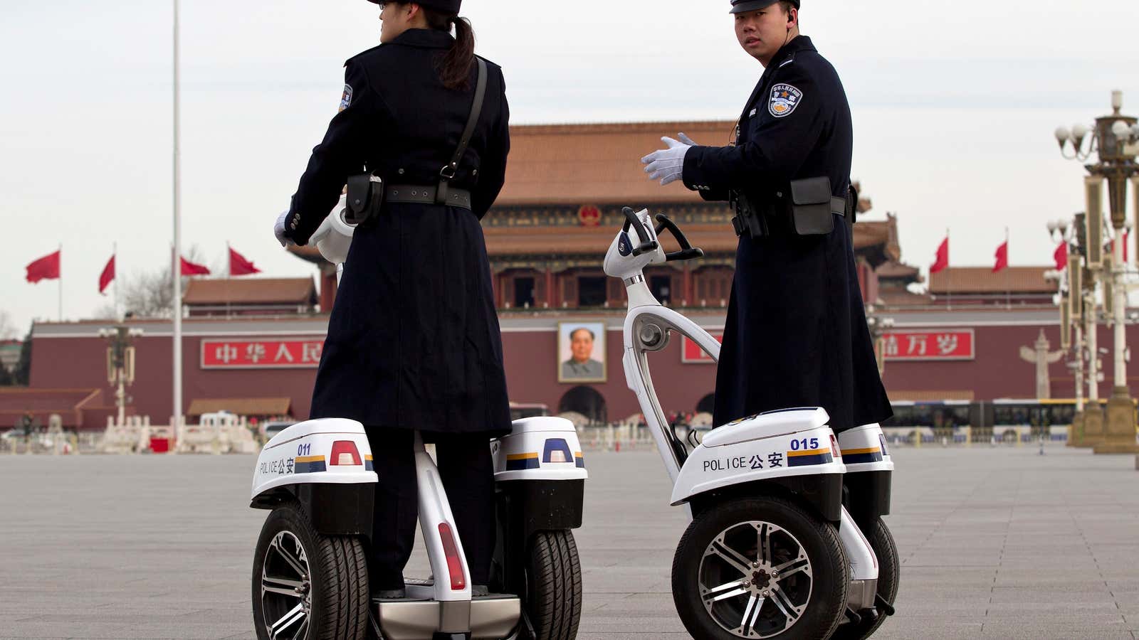 Police patrol Beijing’s Tiananmen Square, the venue where Sky News reporter Mark Stone was arrested last week.