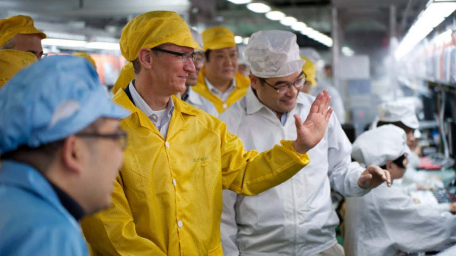Tim Cook watches the (subsidized?) iPhone sausages getting made.